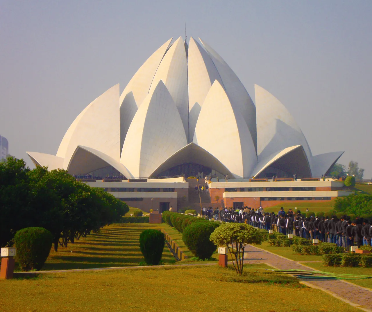 The Lotus Temple's white petals above its gardens